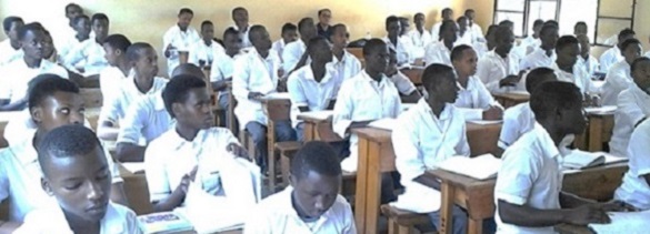 Photos of Prof. Vicente C. Sinining in a classroom supervising a teacher training program in Rwanda.